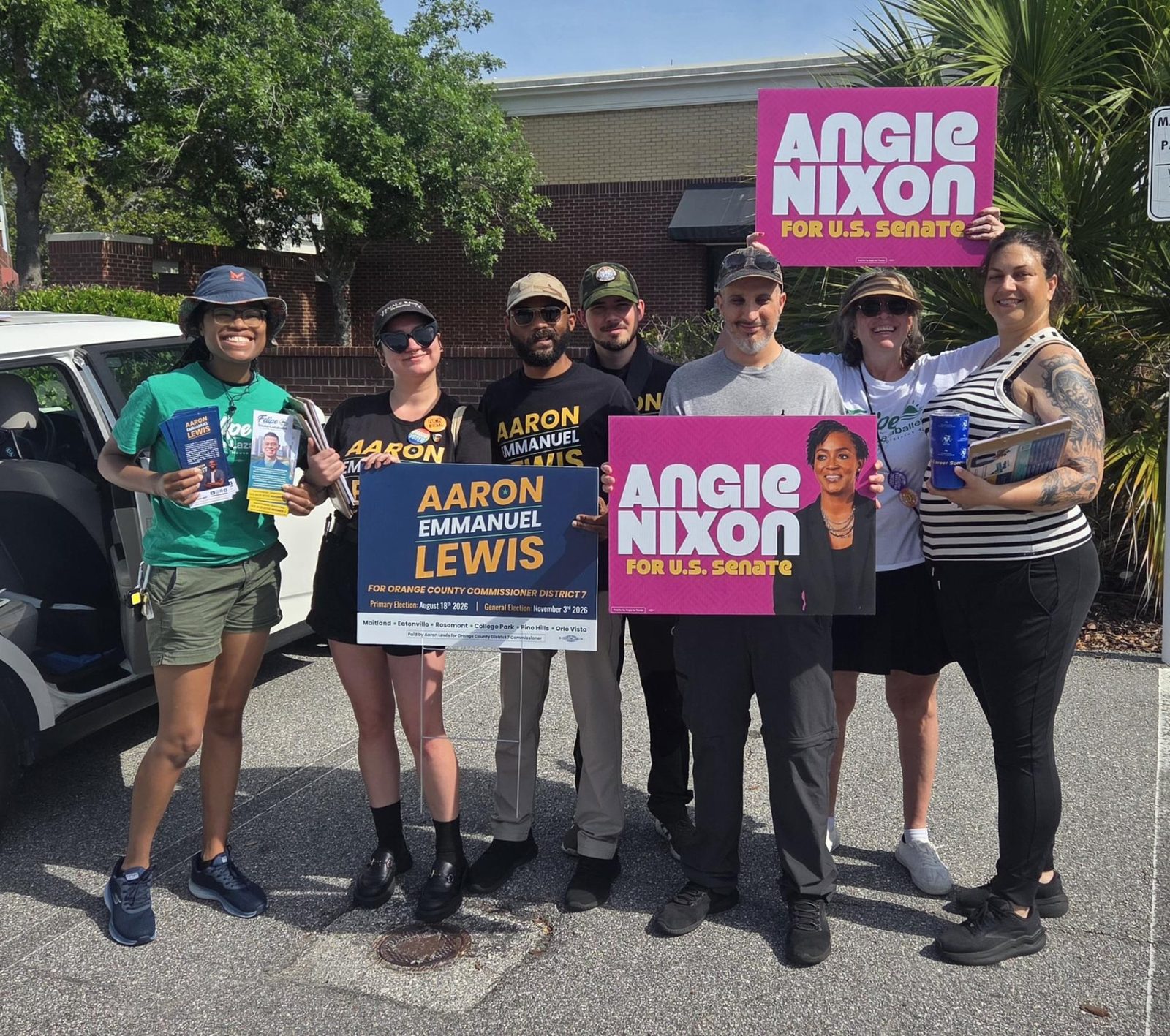 Aaron with community members at a District 7 event