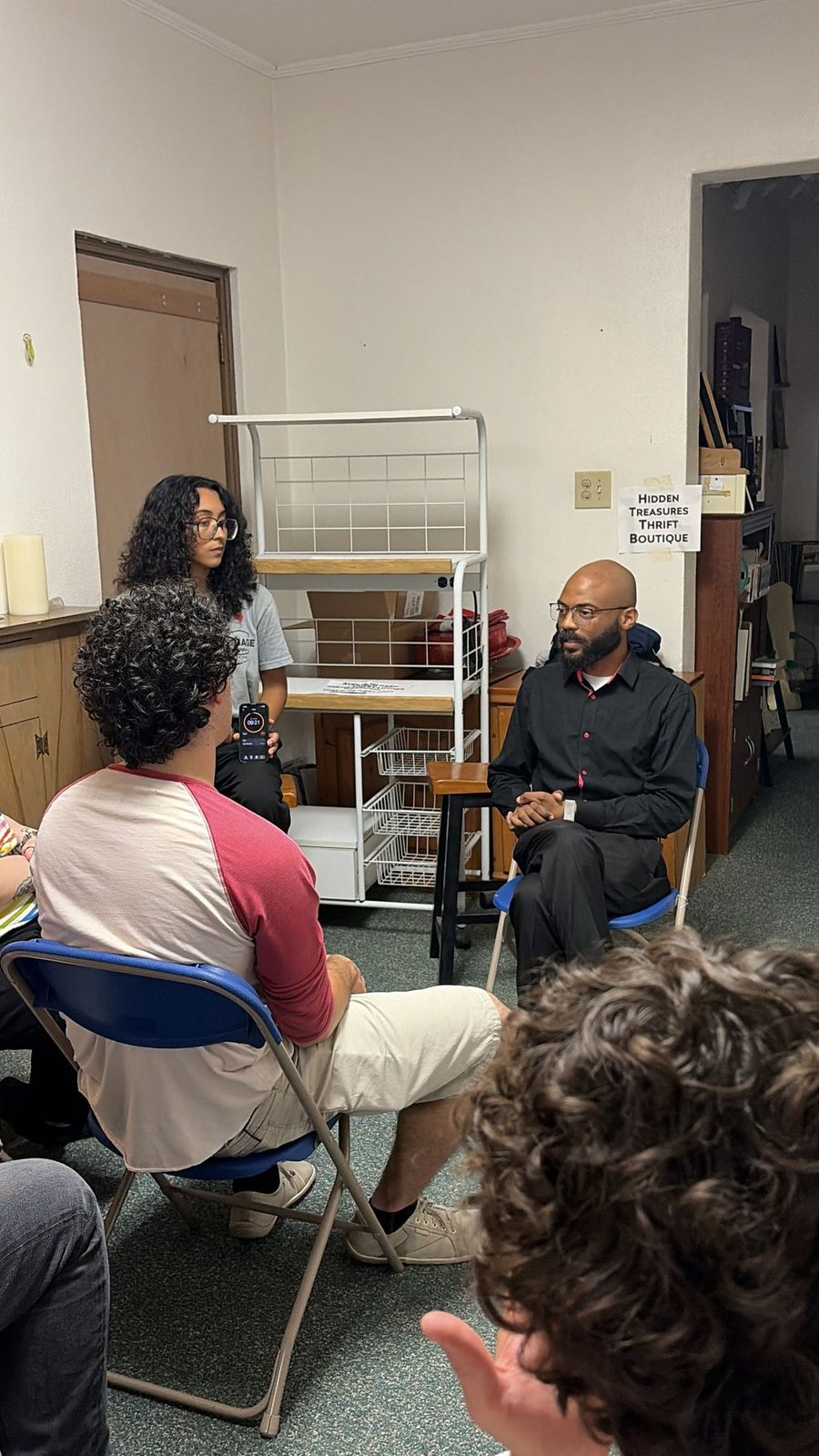 District 7 residents gathered and listening at a community meeting